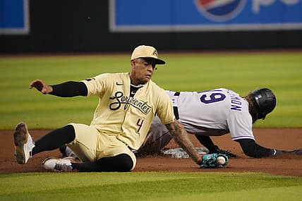Aug 5, 2022; Phoenix, Arizona, USA; Colorado Rockies designated hitter Charlie Blackmon (19) beats a throw to Arizona Diamondbacks second baseman Ketel Marte (4) to steal second base during the fifth inning at Chase Field. Mandatory Credit: Joe Camporeale-USA TODAY Sports