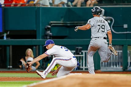Aug 6, 2022; Arlington, Texas, USA; Chicago White Sox first baseman Jose Abreu (79) beats out a double play against Texas Rangers first baseman Nathaniel Lowe (30) during the fourth inning at Globe Life Field. Mandatory Credit: Andrew Dieb-USA TODAY Sports