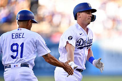 Aug 6, 2022; Los Angeles, California, USA; Los Angeles Dodgers designated hitter Will Smith (16) is greeted by third base coach Dino Ebel (91) after hitting a solo home run against the San Diego Padres during the second inning at Dodger Stadium. Mandatory Credit: Gary A. Vasquez-USA TODAY Sports