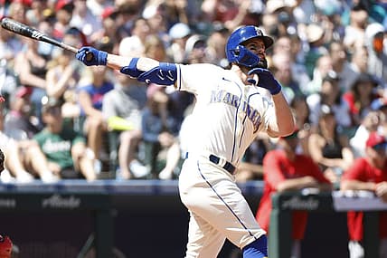 Aug 7, 2022; Seattle, Washington, USA; Seattle Mariners left fielder Jesse Winker (27) hits a grand-slam home run against the Los Angeles Angels during the third inning at T-Mobile Park. Mandatory Credit: Joe Nicholson-USA TODAY Sports