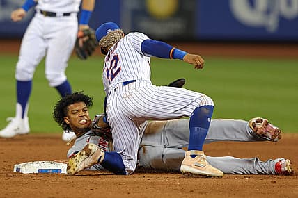 Aug 8, 2022; New York City, New York, USA;  Cincinnati Reds shortstop Jose Barrero (2) steals second base as New York Mets shortstop Francisco Lindor (12) tags during the fifth inning at Citi Field. Mandatory Credit: Vincent Carchietta-USA TODAY Sports
