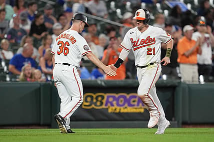 Aug 8, 2022; Baltimore, Maryland, USA; Baltimore Orioles outfielder Austin Hays (21) greeted by coach Tony Mansolino (36) after his solo home run in the sixth inning against the Toronto Blue Jays at Oriole Park at Camden Yards. Mandatory Credit: Mitch Stringer-USA TODAY Sports