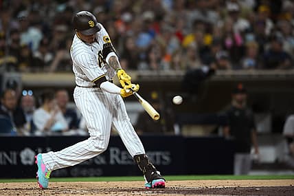 Aug 8, 2022; San Diego, California, USA; San Diego Padres third baseman Manny Machado (13) hits a single during the fourth inning against the San Francisco Giants at Petco Park. Mandatory Credit: Orlando Ramirez-USA TODAY Sports