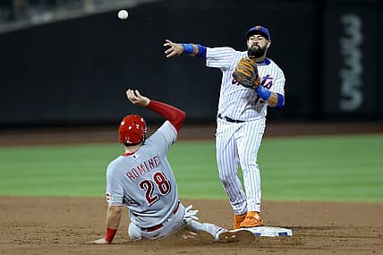 Aug 9, 2022; New York City, New York, USA; New York Mets second baseman Luis Guillorme (13) forces out Cincinnati Reds catcher Austin Romine (28) at second and throws to first to attempt a double play on a ball hit by Reds center fielder Nick Senzel (not pictured) during the third inning at Citi Field. Senzel was safe at first. Mandatory Credit: Brad Penner-USA TODAY Sports