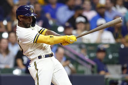Aug 9, 2022; Milwaukee, Wisconsin, USA;  Milwaukee Brewers designated hitter Andrew McCutchen (24) hits an RBI single during the fifth inning against the Tampa Bay Rays at American Family Field. Mandatory Credit: Jeff Hanisch-USA TODAY Sports