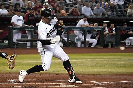 Aug 9, 2022; Phoenix, Arizona, USA; Arizona Diamondbacks first baseman Christian Walker (53) hits an RBI single against the Pittsburgh Pirates during the first inning at Chase Field. Mandatory Credit: Joe Camporeale-USA TODAY Sports
