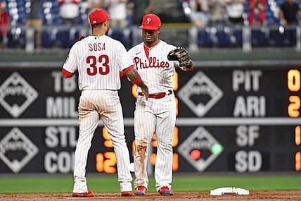 Aug 9, 2022; Philadelphia, Pennsylvania, USA; Philadelphia Phillies shortstop Edmundo Sosa (33) and  second baseman Jean Segura (2)  celebrate win against the Miami Marlins at Citizens Bank Park. Mandatory Credit: Eric Hartline-USA TODAY Sports