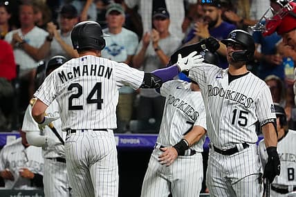 Aug 9, 2022; Denver, Colorado, USA; Colorado Rockies third baseman Ryan McMahon (24) celebrates his two run home run with right fielder Randal Grichuk (15) in the seventh inning against the St. Louis Cardinals at Coors Field. Mandatory Credit: Ron Chenoy-USA TODAY Sports