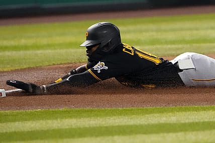 Aug 9, 2022; Phoenix, Arizona, USA; Pittsburgh Pirates second baseman Rodolfo Castro (14) loses his iPhone as he slides into third base against the Arizona Diamondbacks during the fourth inning at Chase Field. Mandatory Credit: Joe Camporeale-USA TODAY Sports