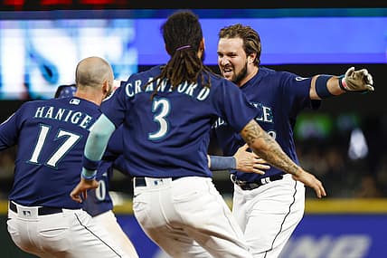 Aug 9, 2022; Seattle, Washington, USA; Seattle Mariners pinch hitter Luis Torrens (22) celebrates after hitting a walk-off RBI-single against the New York Yankees during the thirteenth inning at T-Mobile Park. Seattle defeated New York, 1-0. Mandatory Credit: Joe Nicholson-USA TODAY Sports
