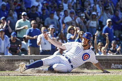 Aug 10, 2022; Chicago, Illinois, USA; Chicago Cubs third baseman Patrick Wisdom (16) scores against the Washington Nationals during the seventh inning at Wrigley Field. Mandatory Credit: Kamil Krzaczynski-USA TODAY Sports