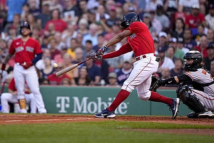 Aug 11, 2022; Boston, Massachusetts, USA; Boston Red Sox shortstop Xander Bogaerts (2) hits a double against the Baltimore Orioles during the first inning at Fenway Park. Mandatory Credit: Gregory Fisher-USA TODAY Sports