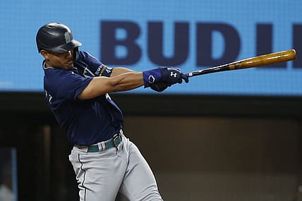 Aug 12, 2022; Arlington, Texas, USA; Seattle Mariners center fielder Julio Rodriguez (44) singles in two runs in the fourth inning against the Texas Rangers at Globe Life Field. Mandatory Credit: Tim Heitman-USA TODAY Sports