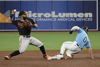 Aug 13, 2022; St. Petersburg, Florida, USA; Baltimore Orioles second baseman Rougned Odor (12) makes the force out at second on Tampa Bay Rays shortstop Taylor Walls (0) in the third inning at Tropicana Field. Mandatory Credit: Dave Nelson-USA TODAY Sports