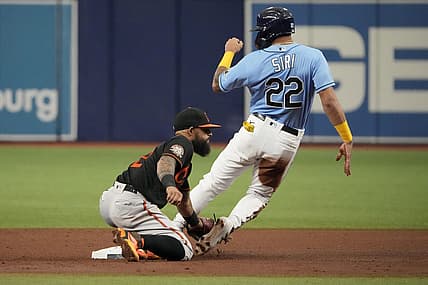 Aug 13, 2022; St. Petersburg, Florida, USA; Tampa Bay Rays center fielder Jose Siri (22) steals second base as Baltimore Orioles second baseman Rougned Odor (12) tries to make the tag during the fourth inning at Tropicana Field. Mandatory Credit: Dave Nelson-USA TODAY Sports