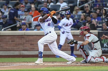 Aug 13, 2022; New York City, New York, USA;  New York Mets right fielder Starling Marte (6) hits a single in the first inning against the Philadelphia Phillies at Citi Field. Mandatory Credit: Wendell Cruz-USA TODAY Sports