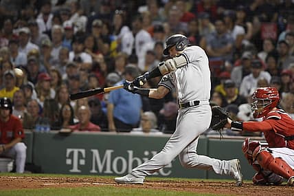 Aug 13, 2022; Boston, Massachusetts, USA;  New York Yankees third baseman Josh Donaldson (28) hits a single during the fourth inning against the Boston Red Sox at Fenway Park. Mandatory Credit: Bob DeChiara-USA TODAY Sports