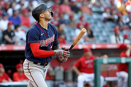 Aug 13, 2022; Anaheim, California, USA;  Minnesota Twins shortstop Carlos Correa (4) hits a home run in the first inning against the Los Angeles Angels at Angel Stadium. Mandatory Credit: Kiyoshi Mio-USA TODAY Sports