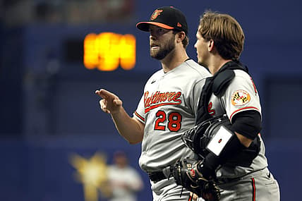 Aug 14, 2022; St. Petersburg, Florida, USA;Baltimore Orioles starting pitcher Jordan Lyles (28) and catcher Adley Rutschman (35) talk against the Tampa Bay Rays at the end of the first inning at Tropicana Field. Mandatory Credit: Kim Klement-USA TODAY Sports