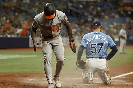 Aug 14, 2022; St. Petersburg, Florida, USA; Baltimore Orioles shortstop Jorge Mateo (3) scores a run on a wild pitch by Tampa Bay Rays starting pitcher Drew Rasmussen (57) during the ninth inning at Tropicana Field. Mandatory Credit: Kim Klement-USA TODAY Sports