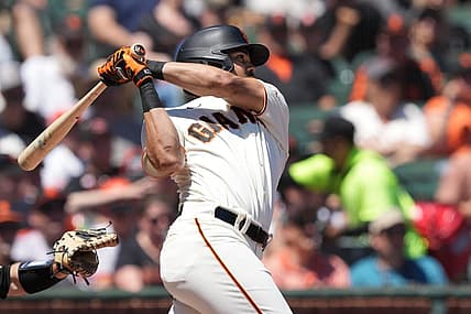 Aug 14, 2022; San Francisco, California, USA; San Francisco Giants right fielder LaMonte Wade Jr. (31) hits a home run against the Pittsburgh Pirates during the second inning at Oracle Park. Mandatory Credit: Darren Yamashita-USA TODAY Sports