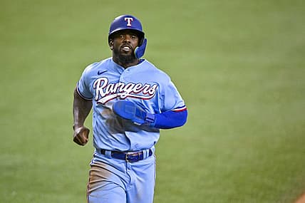 Aug 14, 2022; Arlington, Texas, USA; Texas Rangers right fielder Adolis Garcia (53) scores against the Seattle Mariners during the seventh inning at Globe Life Field. Mandatory Credit: Jerome Miron-USA TODAY Sports