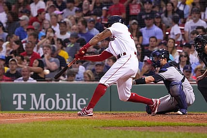 Aug 14, 2022; Boston, Massachusetts, USA; Boston Red Sox left fielder Tommy Pham (22) hits a single against the New York Yankees during the third inning at Fenway Park. Mandatory Credit: Gregory Fisher-USA TODAY Sports