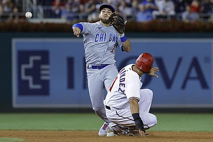 Aug 15, 2022; Washington, District of Columbia, USA; Chicago Cubs second baseman Nick Madrigal (1) attempts to turn a double play from second base ahead of the slide of Washington Nationals second baseman Cesar Hernandez (1) during the fifth inning at Nationals Park. Mandatory Credit: Geoff Burke-USA TODAY Sports