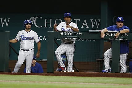 Aug 15, 2022; Arlington, Texas, USA; Texas Rangers interim manager Tony Beasley (27) watches the game in the eighth inning against the Oakland Athletics at Globe Life Field. Mandatory Credit: Tim Heitman-USA TODAY Sports
