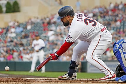 Aug 16, 2022; Minneapolis, Minnesota, USA; Minnesota Twins catcher Sandy Leon (39) lays down an RBI sacrifice bunt against the Kansas City Royals in the first inning at Target Field. Mandatory Credit: Bruce Kluckhohn-USA TODAY Sports