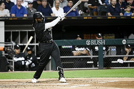 Aug 16, 2022; Chicago, Illinois, USA; Chicago White Sox second baseman Josh Harrison (5) hits an RBI single against the Houston Astros during the second inning at Guaranteed Rate Field. Mandatory Credit: Matt Marton-USA TODAY Sports