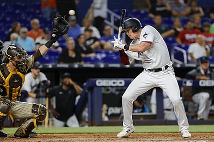 Aug 16, 2022; Miami, Florida, USA; Miami Marlins first baseman Garrett Cooper (26) reacts after getting hit by a pitch during the eighth inning against the San Diego Padres at loanDepot Park. Mandatory Credit: Sam Navarro-USA TODAY Sports