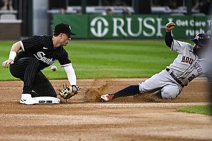 Aug 17, 2022; Chicago, Illinois, USA;  Houston Astros second baseman Jose Altuve (27) slides safely into second base after a steal as Chicago White Sox shortstop Romy Gonzalez missed the tag during the first inning at Guaranteed Rate Field. Mandatory Credit: Matt Marton-USA TODAY Sports