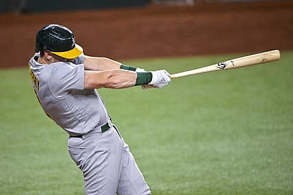 Aug 17, 2022; Arlington, Texas, USA; Oakland Athletics catcher Sean Murphy (12) hits a two run home run during the fourth inning against the Texas Rangers at Globe Life Field. Mandatory Credit: Jerome Miron-USA TODAY Sports