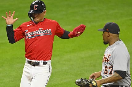 Aug 17, 2022; Cleveland, Ohio, USA; Cleveland Guardians second baseman Andres Gimenez (0) scores on a passed ball beside Detroit Tigers relief pitcher Jose Cisnero (67) in the sixth inning at Progressive Field. Mandatory Credit: David Richard-USA TODAY Sports
