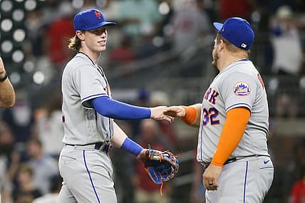Aug 17, 2022; Atlanta, Georgia, USA; New York Mets third baseman Brett Baty (22) celebrates with designated hitter Daniel Vogelbach (32) after a victory against the Atlanta Braves at Truist Park. Mandatory Credit: Brett Davis-USA TODAY Sports