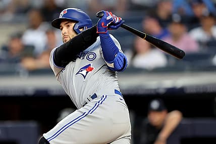 Aug 18, 2022; Bronx, New York, USA; Toronto Blue Jays designated hitter George Springer (4) follows through on an RBI single against the New York Yankees during the second inning at Yankee Stadium. Mandatory Credit: Brad Penner-USA TODAY Sports