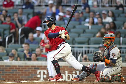 Aug 19, 2022; Atlanta, Georgia, USA; Atlanta Braves shortstop Dansby Swanson (7) hits a single against the Houston Astros in the first inning at Truist Park. Mandatory Credit: Brett Davis-USA TODAY Sports