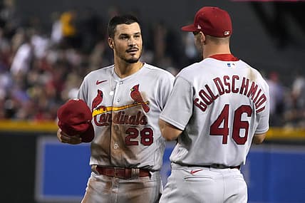 Aug 19, 2022; Phoenix, Arizona, USA; St. Louis Cardinals third baseman Nolan Arenado (28) talks to first baseman Paul Goldschmidt (46) in between innings against the Arizona Diamondbacks at Chase Field. Mandatory Credit: Rick Scuteri-USA TODAY Sports