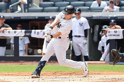 Aug 20, 2022; Bronx, New York, USA; New York Yankees left fielder Andrew Benintendi (18) hits a single against the Toronto Blue Jays during the first inning at Yankee Stadium. Mandatory Credit: Tom Horak-USA TODAY Sports