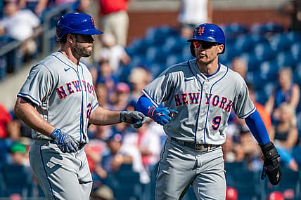 Aug 20, 2022; Philadelphia, Pennsylvania, USA; New York Mets center fielder Brandon Nimmo (9) scores on a sacrifice fly by New York Mets first baseman Darin Ruf (28) against the Philadelphia Phillies during the ninth inning at Citizens Bank Park. Mandatory Credit: John Jones-USA TODAY Sports