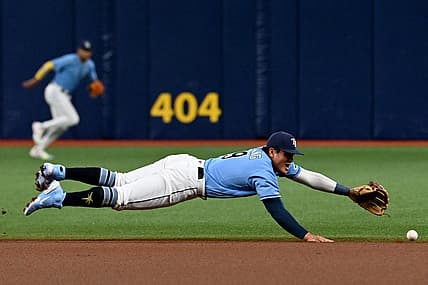 Aug 22, 2022; St. Petersburg, Florida, USA;  Tampa Bay Rays second baseman Yu Chang (9) dives for a ground ball in the first inning against the Los Angeles Angels  at Tropicana Field. Mandatory Credit: Jonathan Dyer-USA TODAY Sports