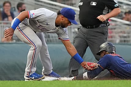 Aug 22, 2022; Minneapolis, Minnesota, USA; Minnesota Twins left fielder Nick Gordon (1) is tagged out by Texas Rangers third baseman Ezequiel Duran (70) after attempting to steal third base during the fourth inning at Target Field. Mandatory Credit: Jordan Johnson-USA TODAY Sports