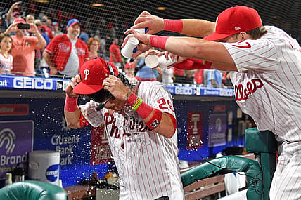 Aug 23, 2022; Philadelphia, Pennsylvania, USA; Philadelphia Phillies second baseman Nick Maton (29) has water dumped on by second baseman Bryson Stott (5) and  first baseman Rhys Hoskins (17) after his walk-off single against the Cincinnati Reds during the ninth inning at Citizens Bank Park. Mandatory Credit: Eric Hartline-USA TODAY Sports
