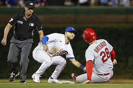 Aug 23, 2022; Chicago, Illinois, USA; Chicago Cubs second baseman Nick Madrigal (1) tags out St. Louis Cardinals third baseman Nolan Arenado (28) at second base during the eight inning of the second game of the doubleheader at Wrigley Field. Mandatory Credit: Kamil Krzaczynski-USA TODAY Sports