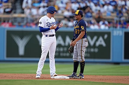 Aug 24, 2022; Los Angeles, California, USA; Los Angeles Dodgers first baseman Freddie Freeman (5) talks with Milwaukee Brewers shortstop Willy Adames (27) in the first inning at Dodger Stadium. Mandatory Credit: Kirby Lee-USA TODAY Sports