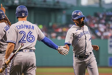 Aug 25, 2022; Boston, Massachusetts, USA; Toronto Blue Jays right fielder Teoscar Hernandez (37) celebrates with Toronto Blue Jays third baseman Matt Chapman (26) after scoring during the first inning against the Boston Red Sox at Fenway Park. Mandatory Credit: Paul Rutherford-USA TODAY Sports