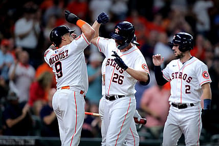 Aug 25, 2022; Houston, Texas, USA; Houston Astros designated hitter Trey Mancini (26) celebrates with Houston Astros catcher Christian Vazquez (9) after hitting a three-run home run against the Minnesota Twins during the first inning at Minute Maid Park. Mandatory Credit: Erik Williams-USA TODAY Sports