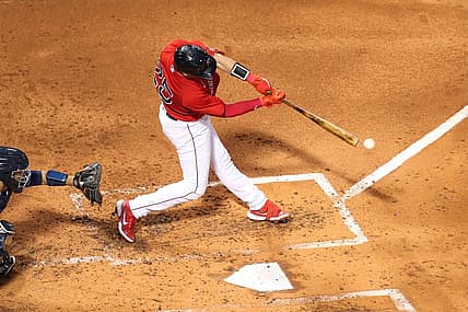 Aug 26, 2022; Boston, Massachusetts, USA; Boston Red Sox catcher Kevin Plawecki (25) hits an RBI during the second inning against the Tampa Bay Rays at Fenway Park. Mandatory Credit: Paul Rutherford-USA TODAY Sports