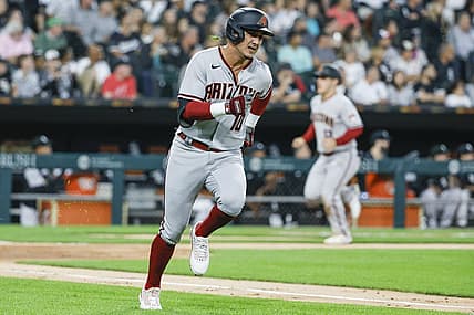 Aug 26, 2022; Chicago, Illinois, USA; Arizona Diamondbacks third baseman Josh Rojas (10) runs to second base after hitting a three-run double against the Chicago White Sox during the second inning at Guaranteed Rate Field. Mandatory Credit: Kamil Krzaczynski-USA TODAY Sports